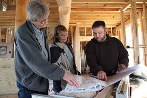 Dale Kidder working with clients on their custom home